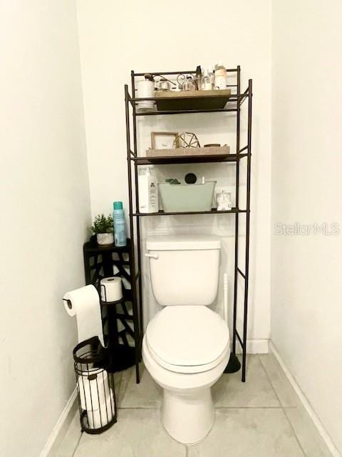 bathroom featuring tile patterned flooring and toilet