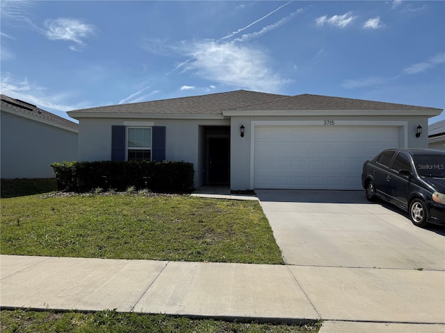 ranch-style house with a front yard, an attached garage, a shingled roof, stucco siding, and concrete driveway