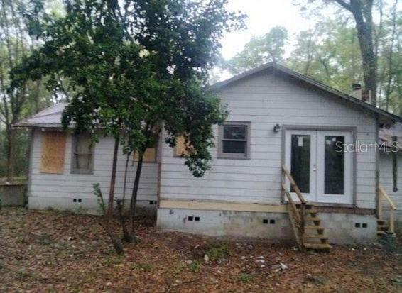 back of house featuring french doors