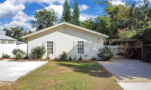 view of front facade with a front lawn and a patio area