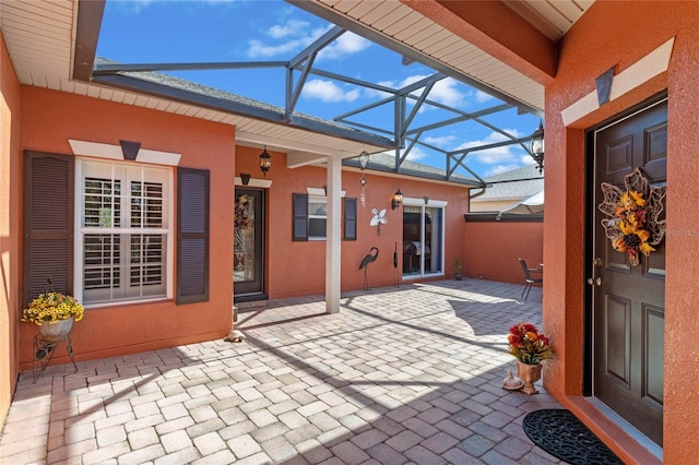 view of patio / terrace with glass enclosure