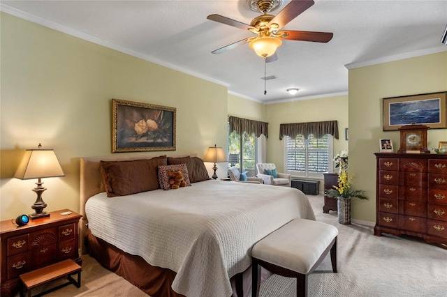 bedroom featuring ceiling fan, light colored carpet, and crown molding