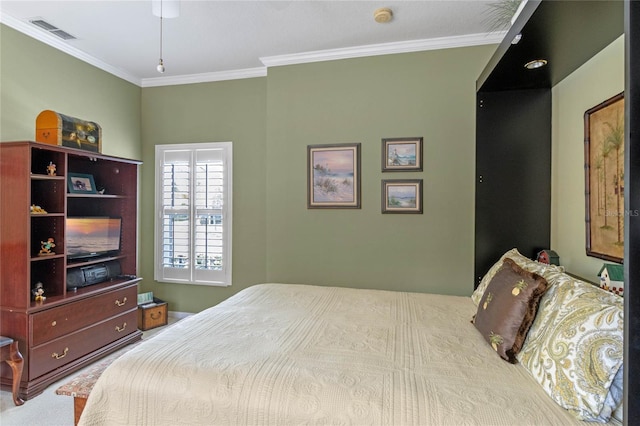 bedroom with carpet floors and ornamental molding