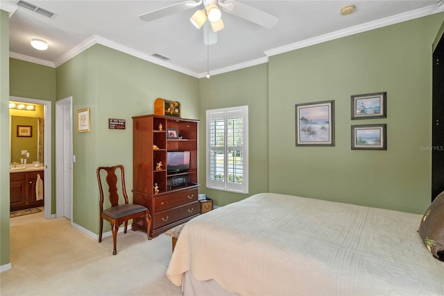 carpeted bedroom with ceiling fan, crown molding, and ensuite bathroom