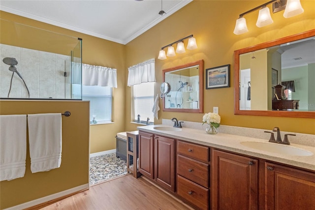 bathroom featuring a shower, vanity, wood-type flooring, and ornamental molding