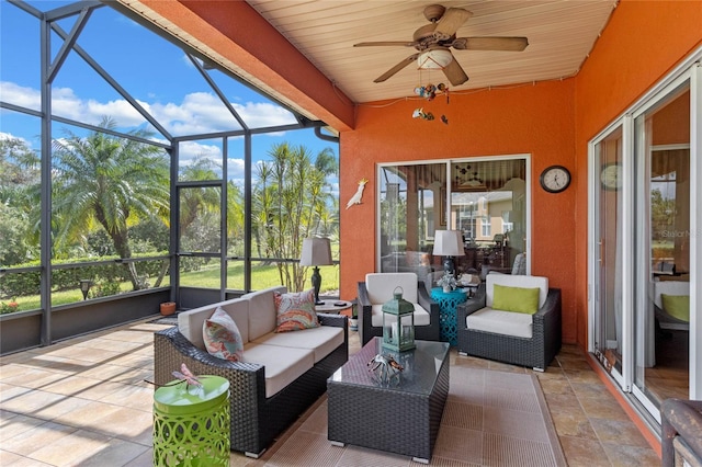 sunroom / solarium with ceiling fan, a healthy amount of sunlight, and wood ceiling