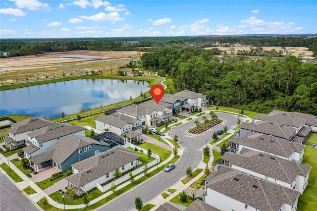 bird's eye view featuring a residential view and a water view