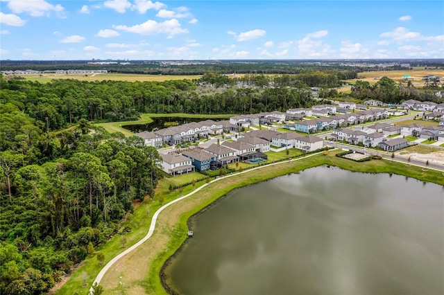 birds eye view of property with a residential view and a water view