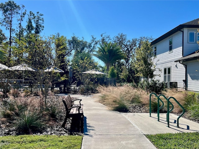 view of community featuring fence