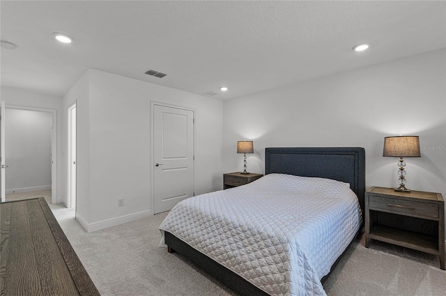 bedroom featuring recessed lighting, visible vents, light colored carpet, and baseboards