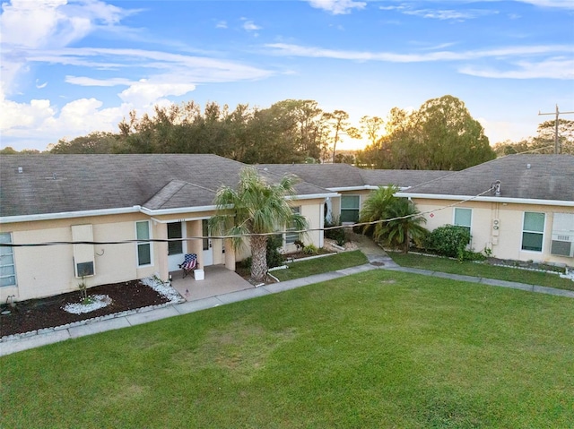 view of front of home with a lawn