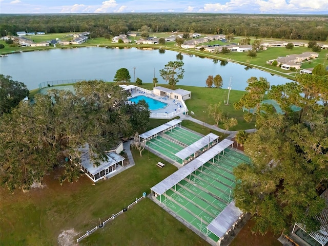 birds eye view of property with a water view