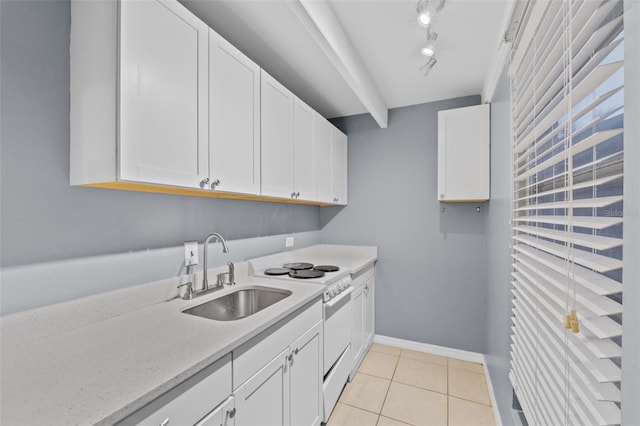 kitchen with white cabinetry, sink, light stone counters, light tile patterned floors, and electric range