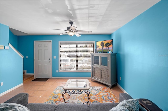 living room with light tile patterned floors and ceiling fan