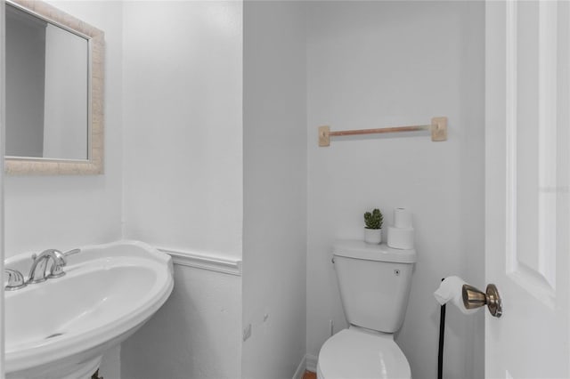 bathroom with toilet and sink