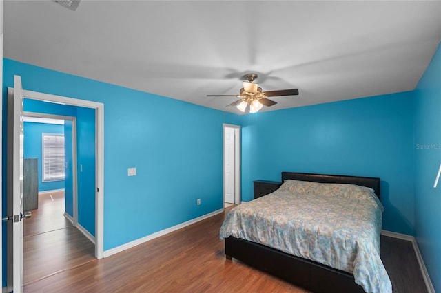 bedroom with hardwood / wood-style flooring and ceiling fan