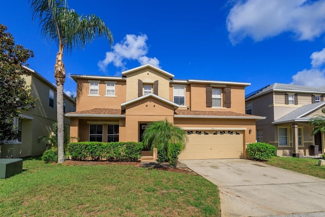 view of front of house featuring a front yard and a garage