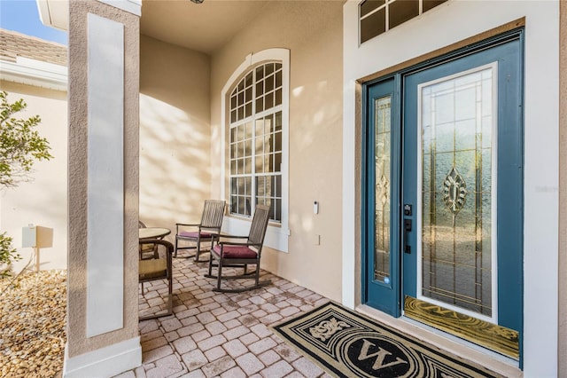 entrance to property featuring covered porch