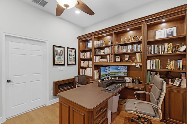 office space featuring light hardwood / wood-style floors and ceiling fan