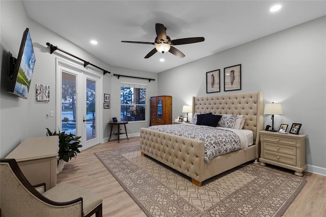 bedroom featuring light wood-type flooring, access to outside, and ceiling fan