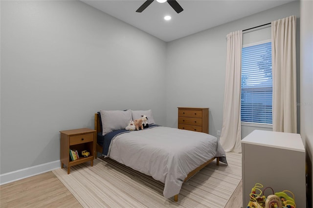 bedroom featuring ceiling fan and light hardwood / wood-style floors