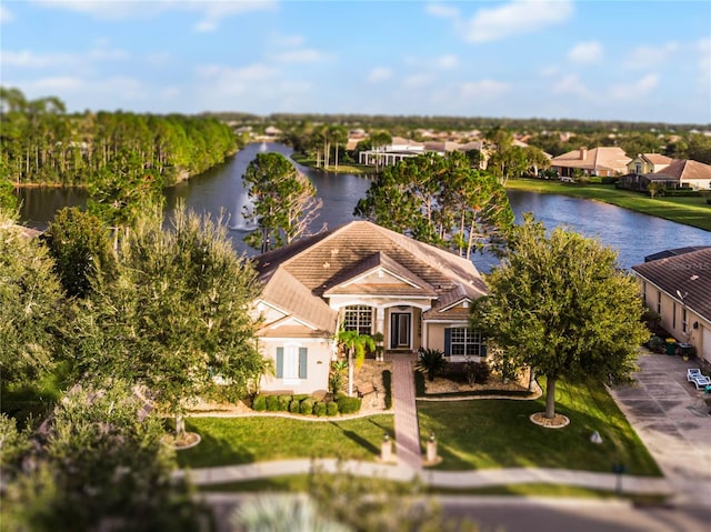 birds eye view of property with a water view