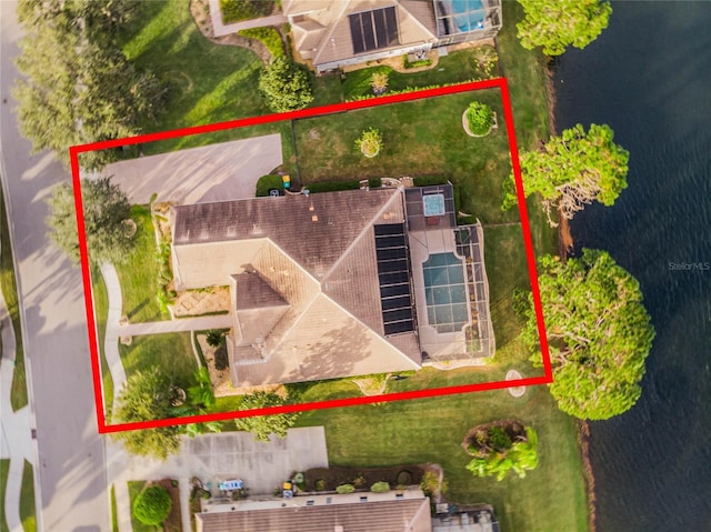 birds eye view of property with a water view