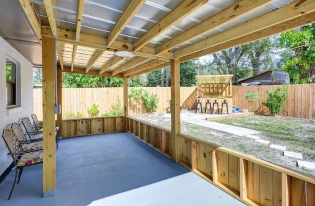 view of patio featuring exterior bar