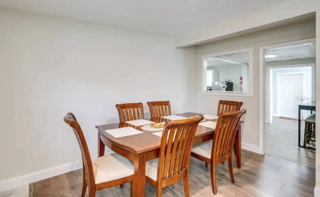 dining area featuring hardwood / wood-style flooring