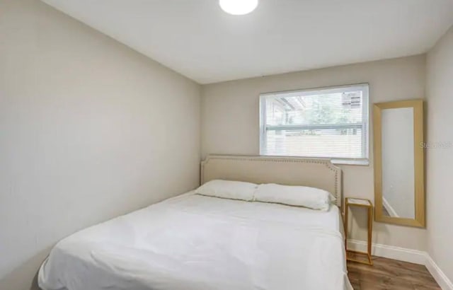 bedroom featuring wood-type flooring