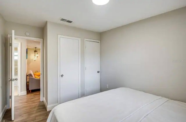 bedroom featuring hardwood / wood-style floors