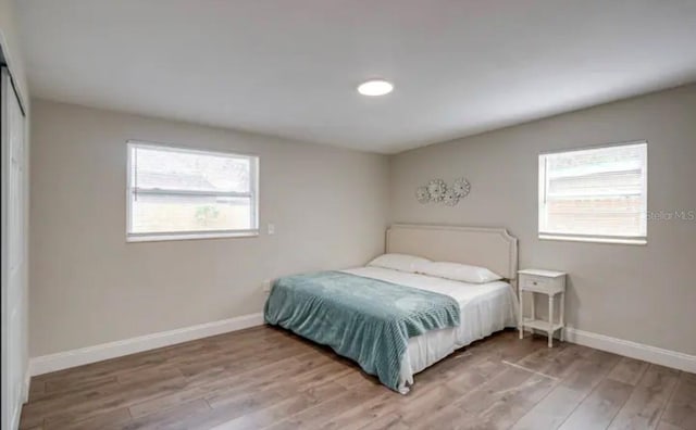 bedroom with hardwood / wood-style floors