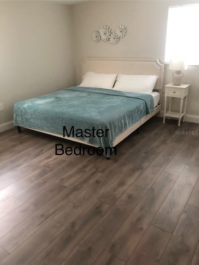 bedroom featuring dark hardwood / wood-style floors