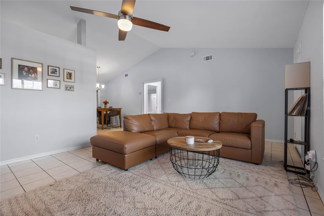 tiled living room with high vaulted ceiling and ceiling fan