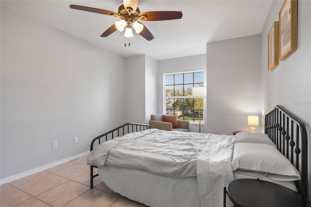 tiled bedroom with ceiling fan