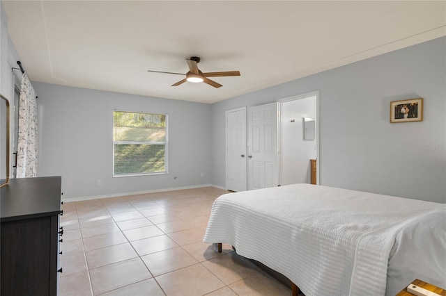 bedroom featuring ceiling fan and light tile patterned flooring