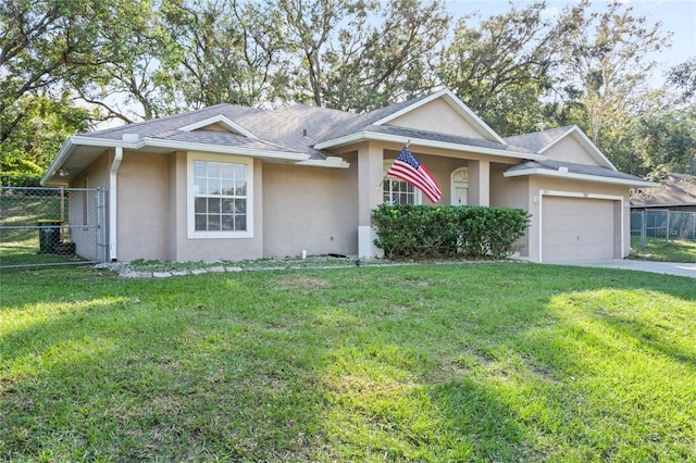 ranch-style home with a garage and a front lawn