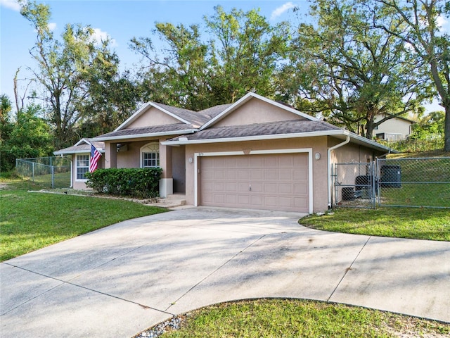 ranch-style home with a front yard and a garage