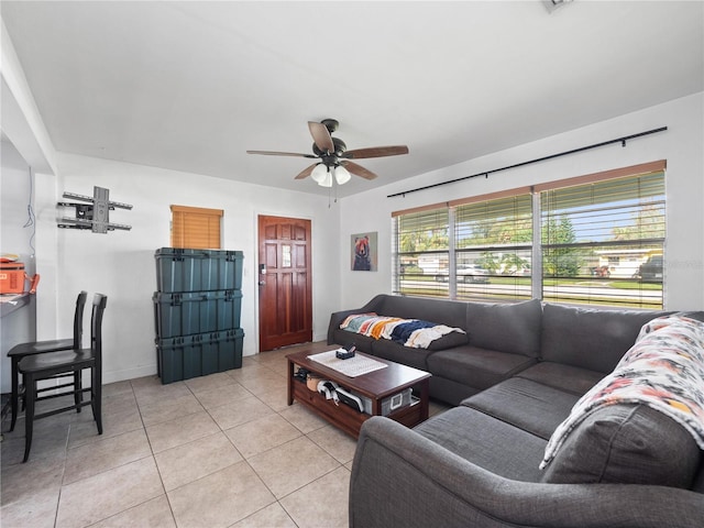 tiled living room featuring ceiling fan