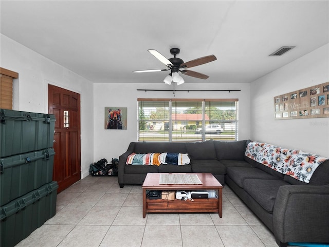 living room featuring ceiling fan and light tile patterned floors