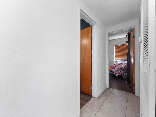 hallway with light tile patterned flooring