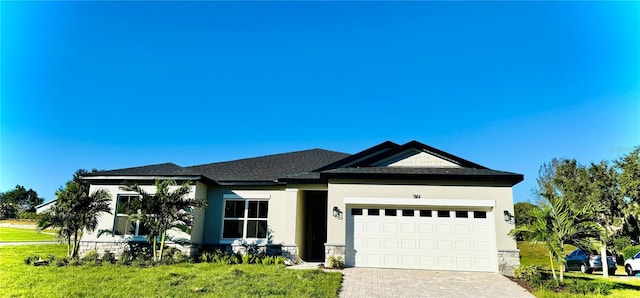 view of front facade with a garage and a front yard