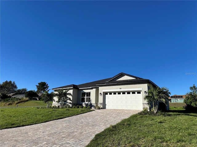 single story home with a garage and a front lawn