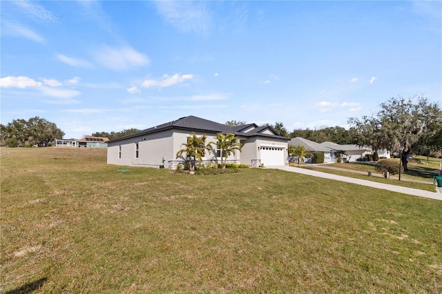 view of front of house with a garage and a front yard