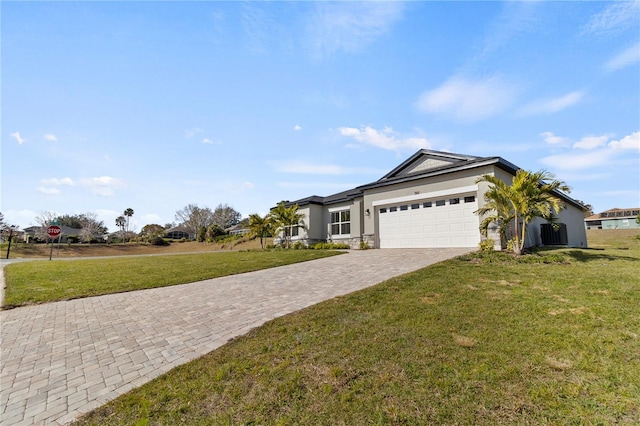 single story home with a garage and a front lawn