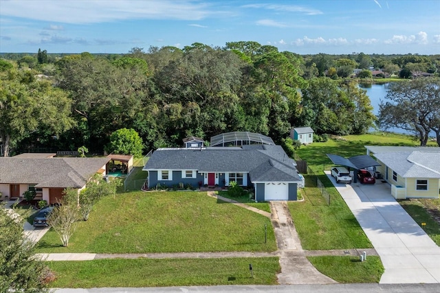 birds eye view of property with a water view