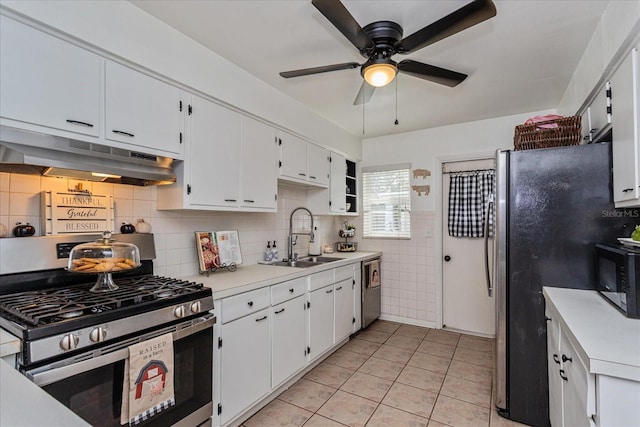 kitchen with white cabinetry, sink, backsplash, light tile patterned floors, and appliances with stainless steel finishes