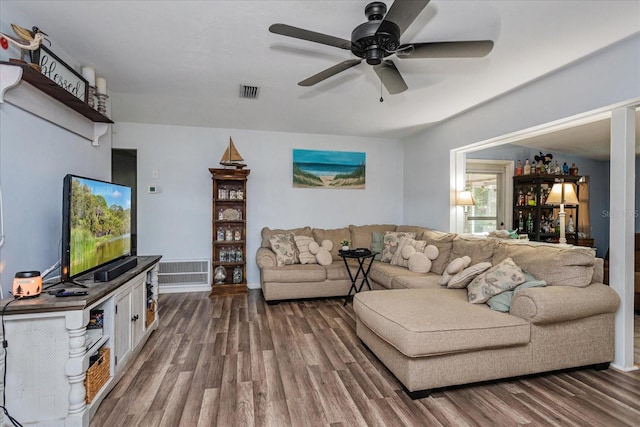 living room featuring hardwood / wood-style flooring and ceiling fan