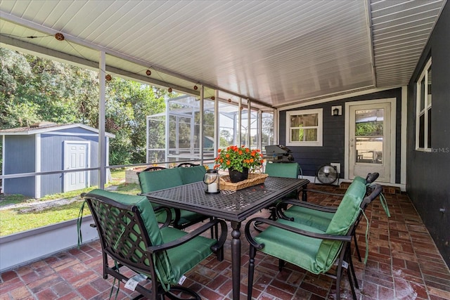 sunroom with plenty of natural light and lofted ceiling