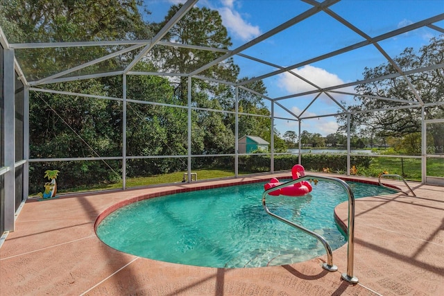 view of pool with a lanai and a patio area